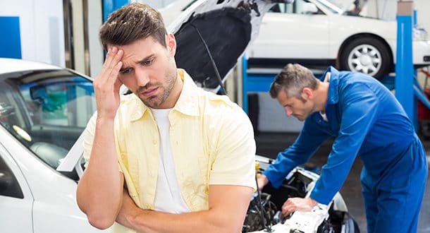 mechanic with worried customer